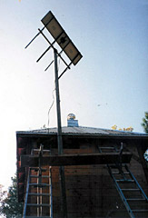 A television antenna on top of a building.